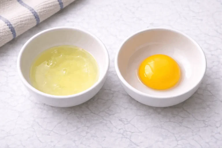 Successfully separated egg white and egg yolk in two bowls showing how to separate eggs properly